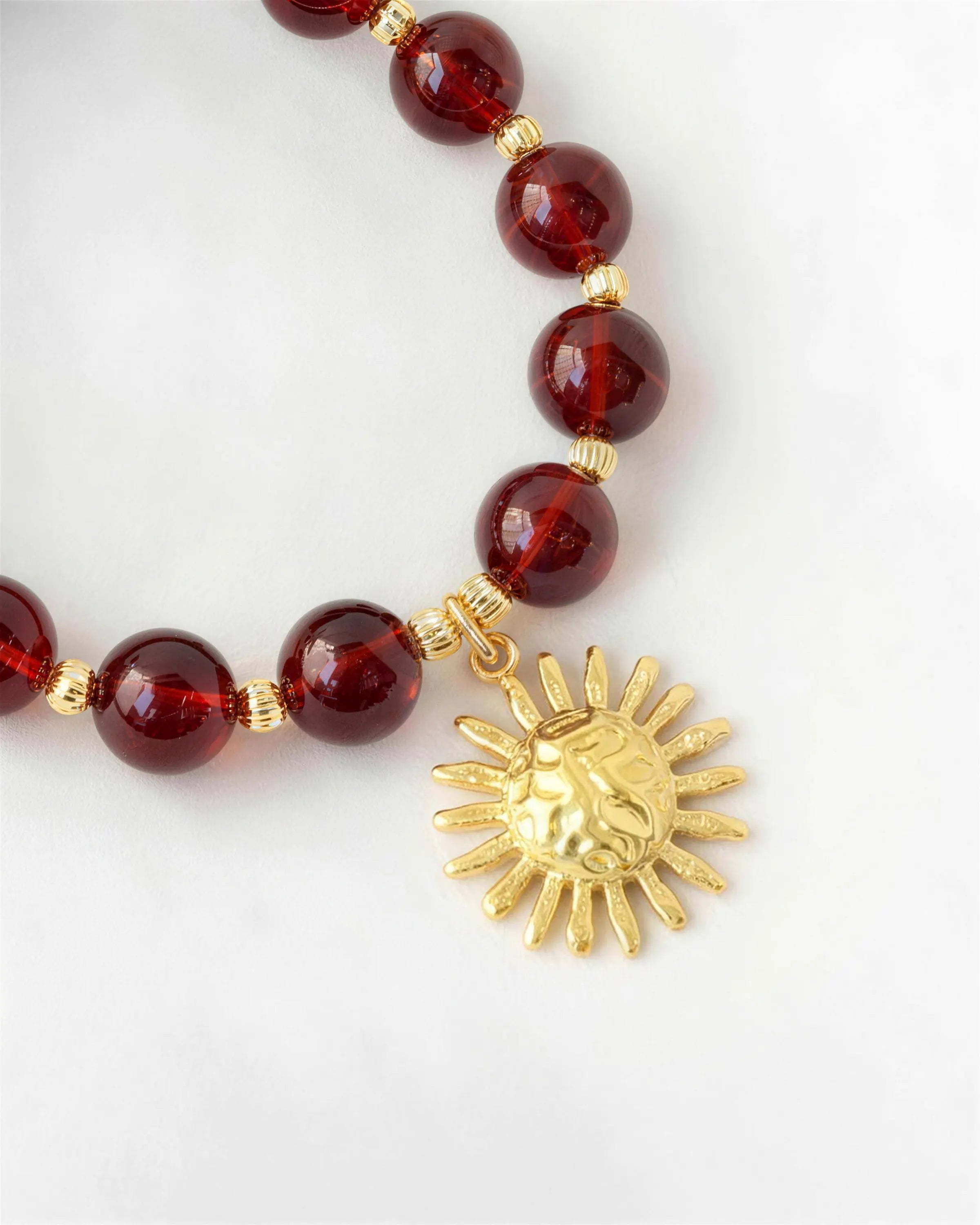 garnet sun gold necklace
