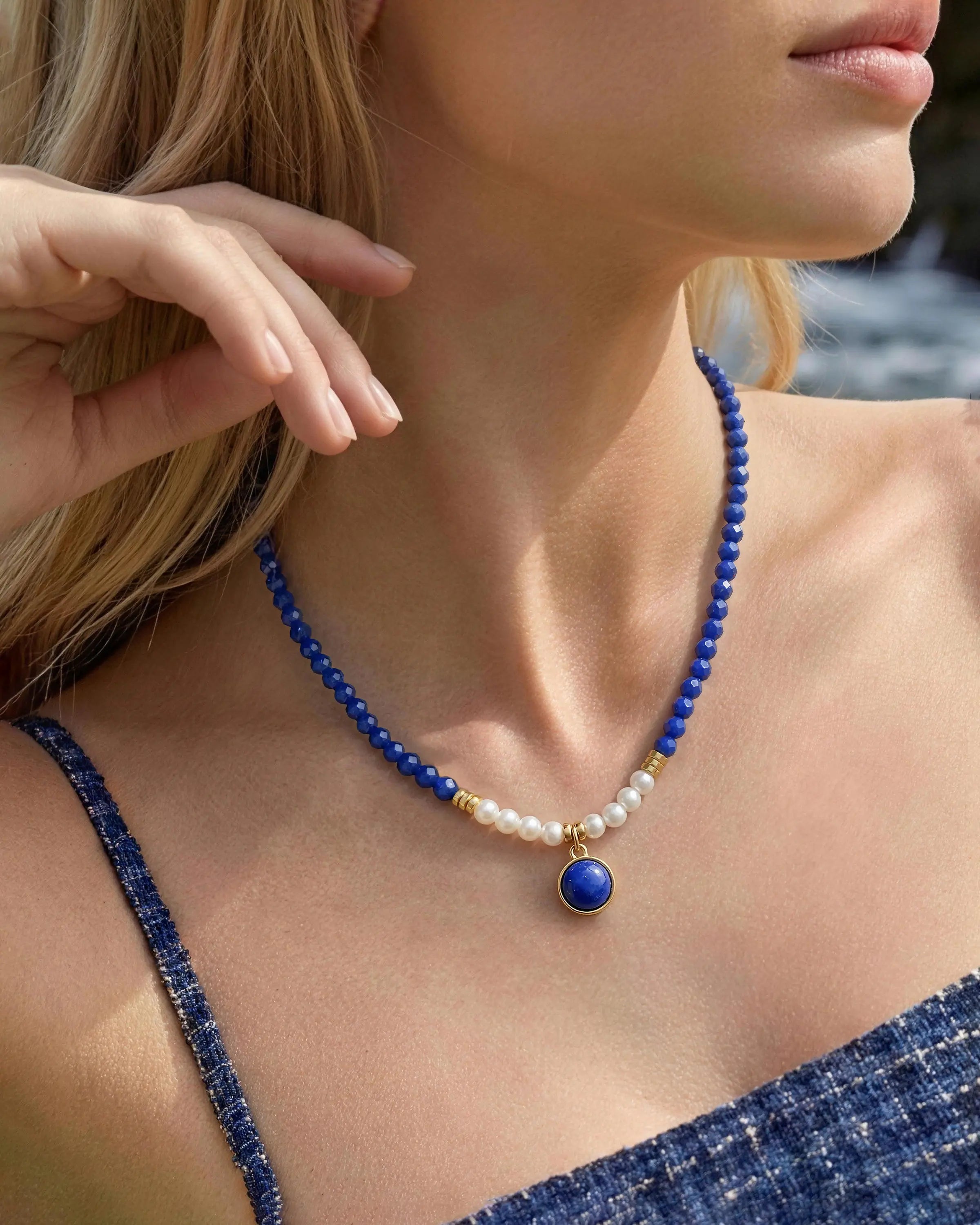 Model wearing Faceted Lapis Pearl Gold Beaded 12mm Gemstone Pendant Necklace