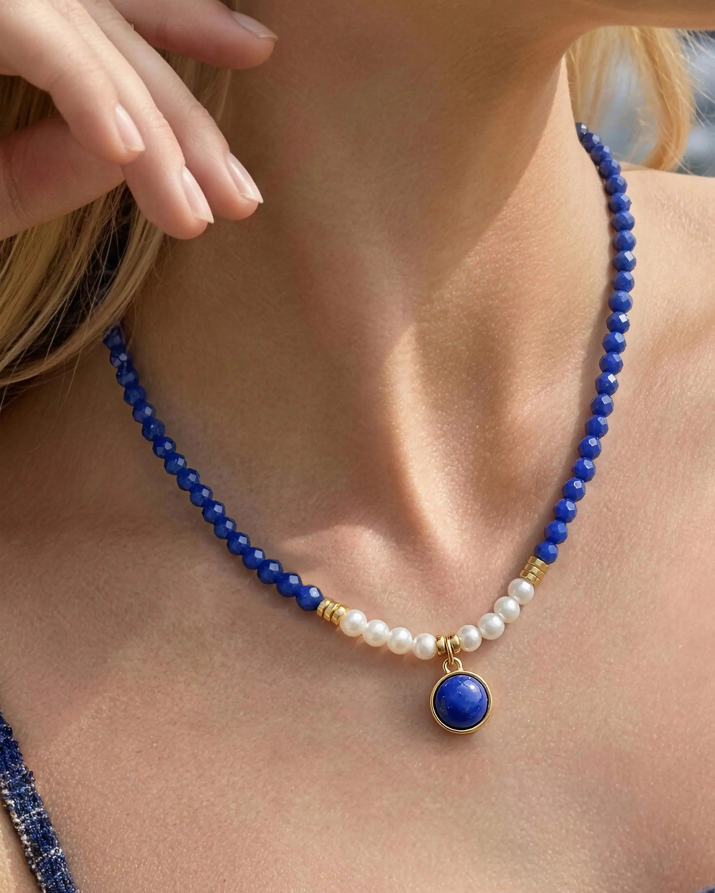 Close-up of Faceted Lapis Pearl Gold Beaded 12mm Gemstone Pendant Necklace on neck