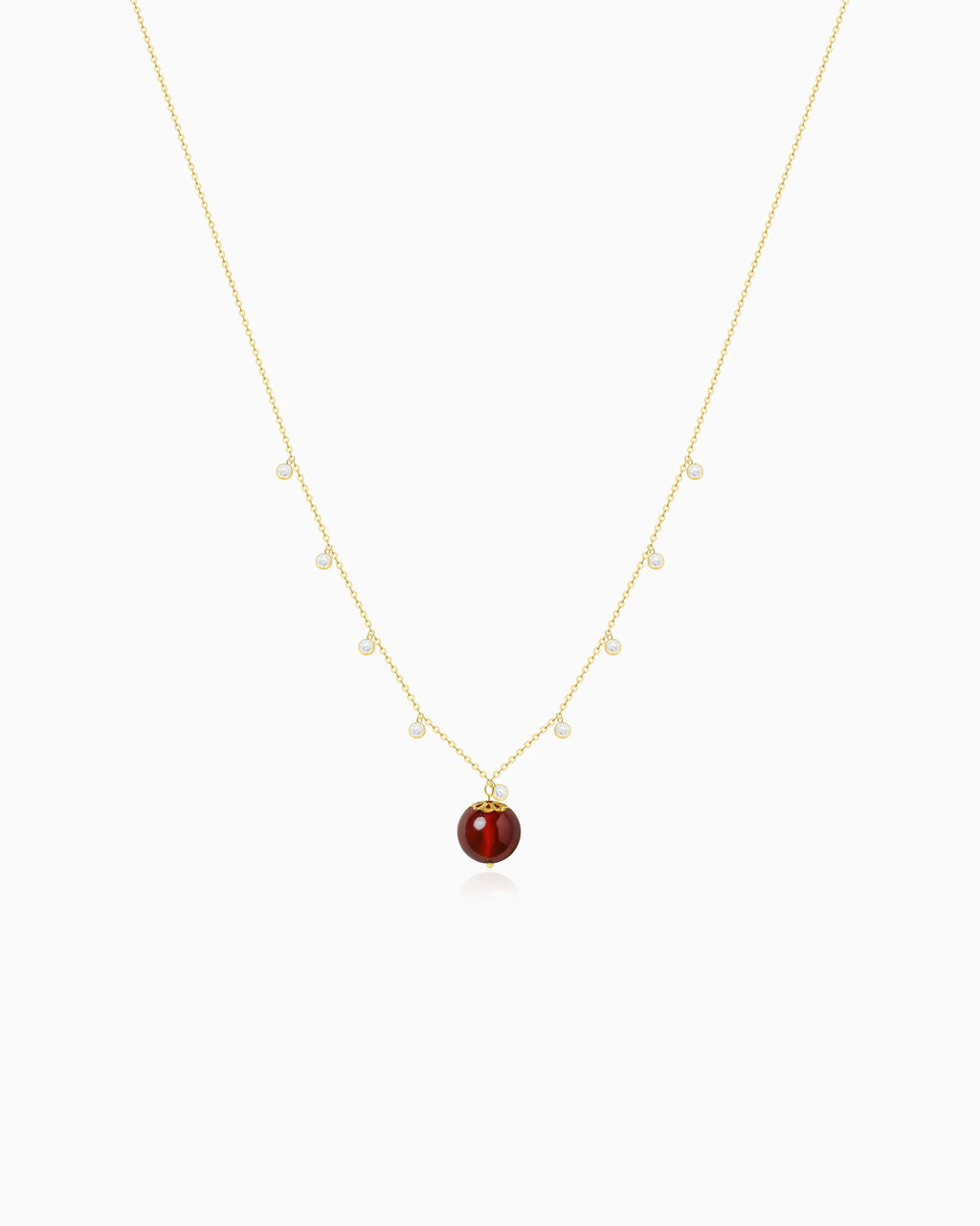 Garnet bead detail of Gold Orbit Necklace