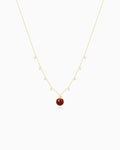 Garnet bead detail of Gold Orbit Necklace