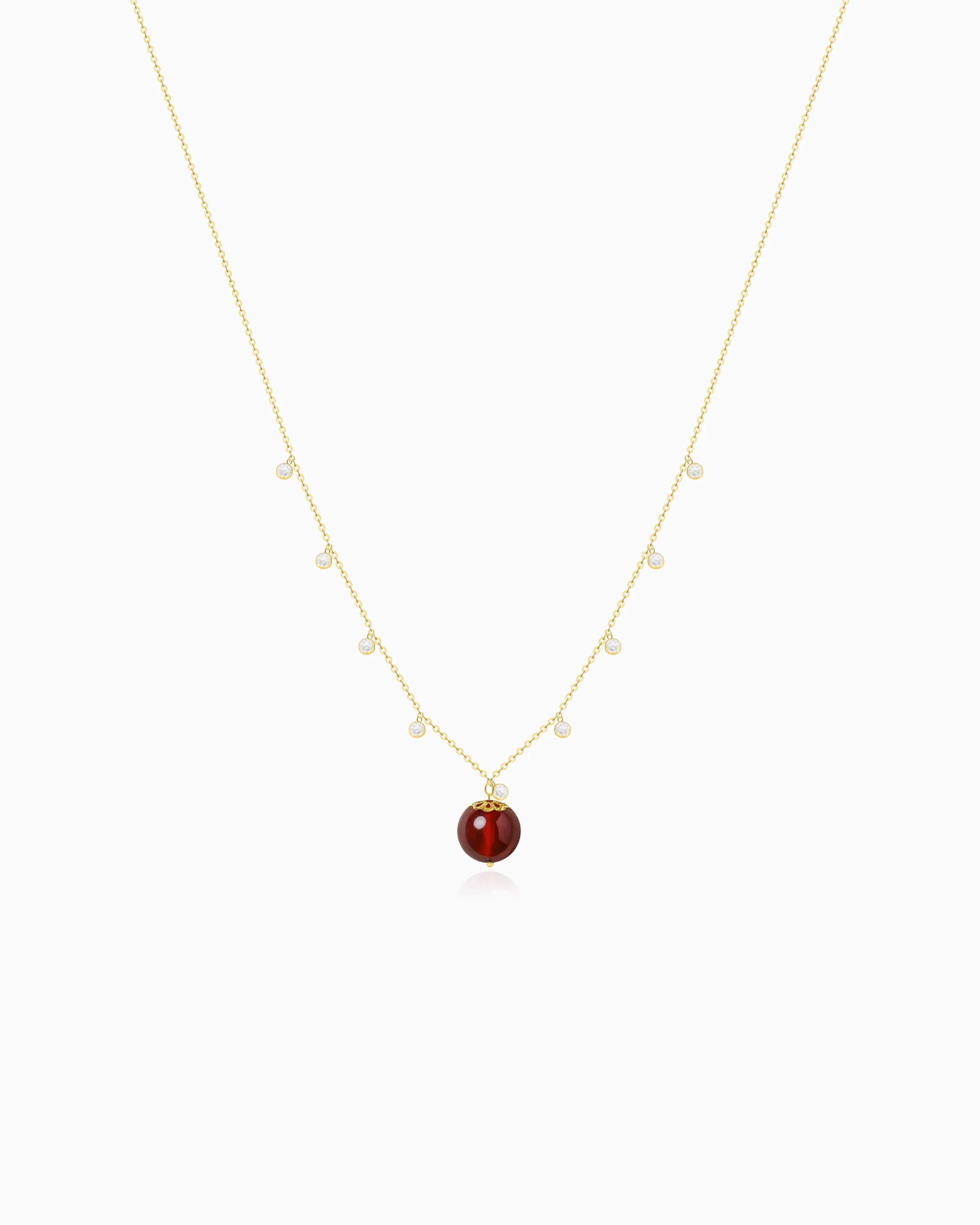 Garnet bead detail of Gold Orbit Necklace