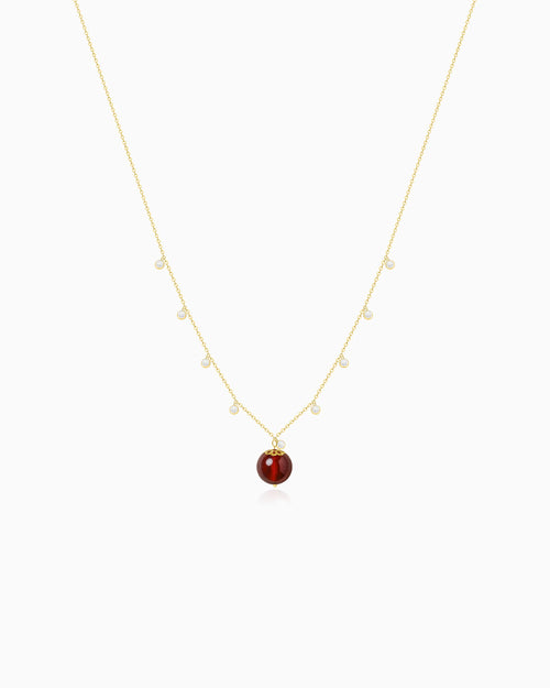 Garnet bead detail of Gold Orbit Necklace