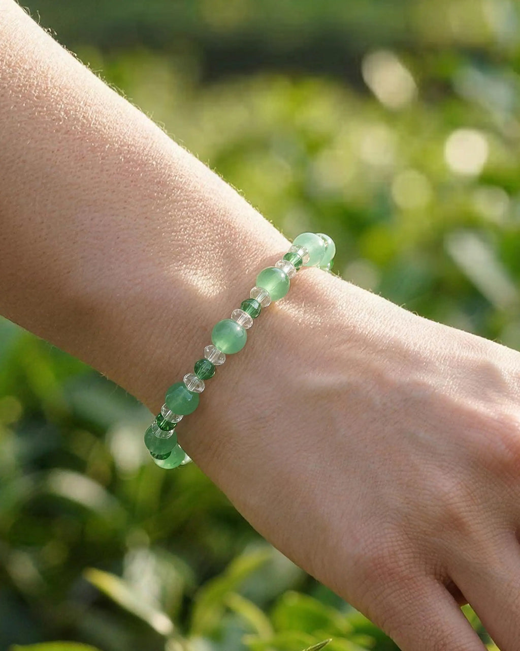 close-up of Green Jade and Clear Quartz Silver Bracelet on wrist