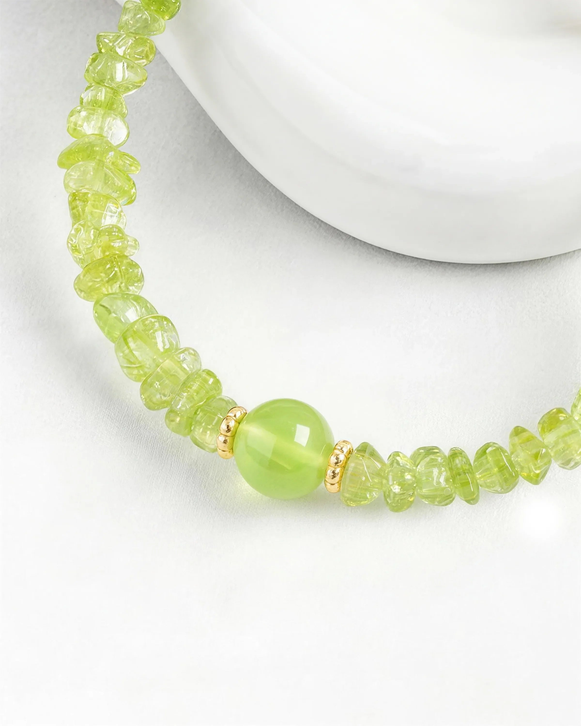 Peridot bead detail of Gold Freeform Chips Focal Bracelet