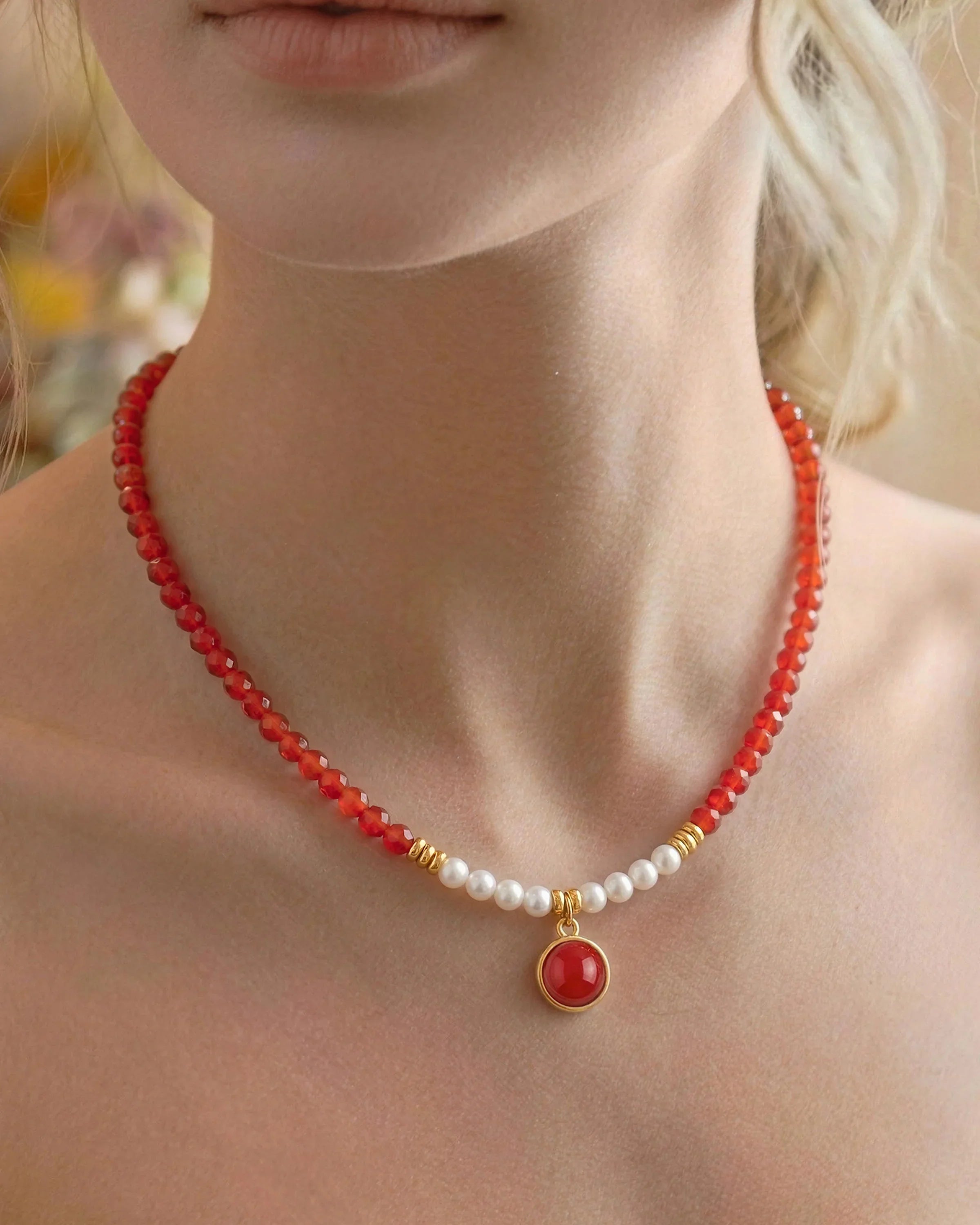 Close-up of Red Agate Pearl Gold 12mm Gemstone Pendant Necklace on neck