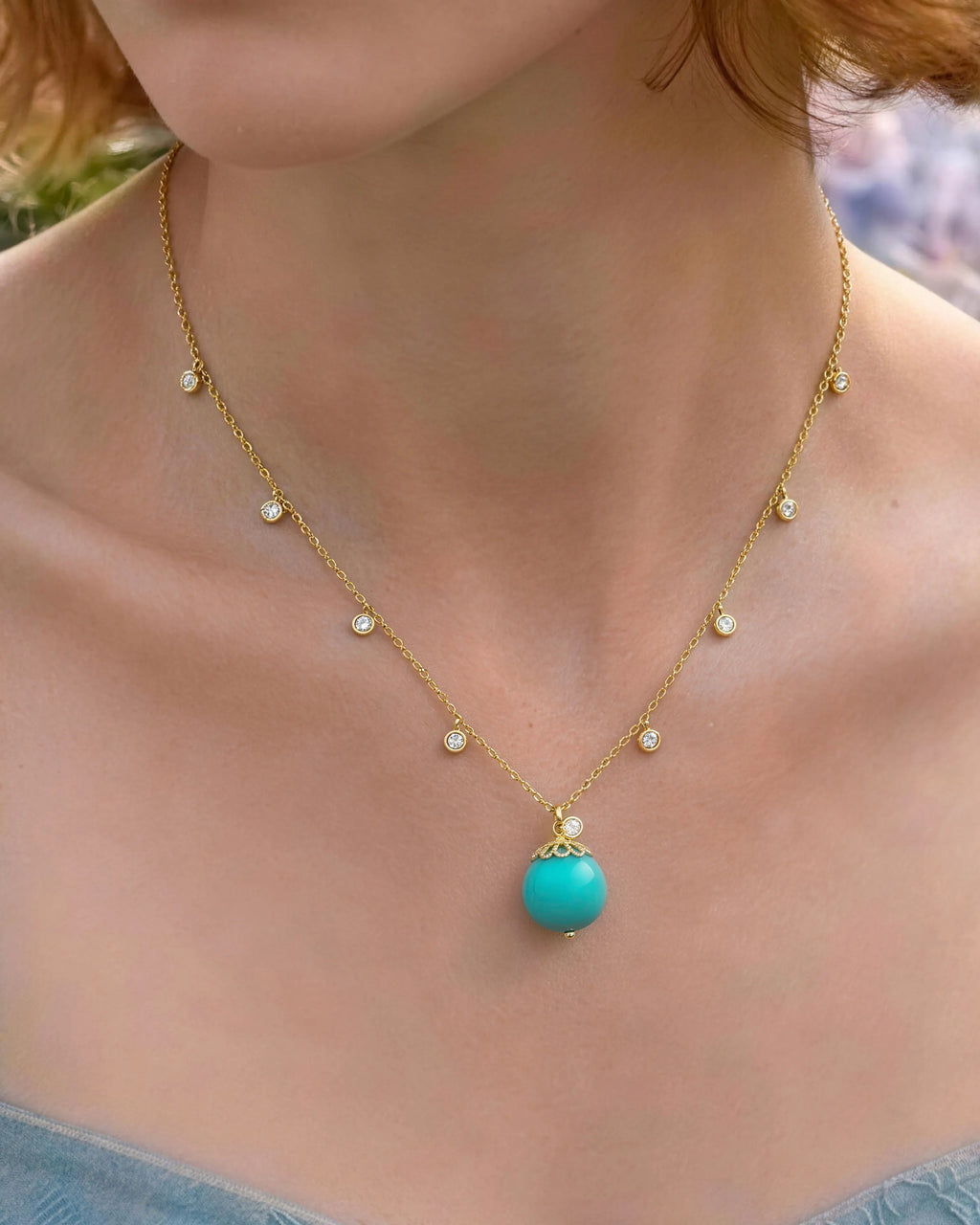 Close-up of Turquoise Gold Orbit 10mm Necklace on neck
