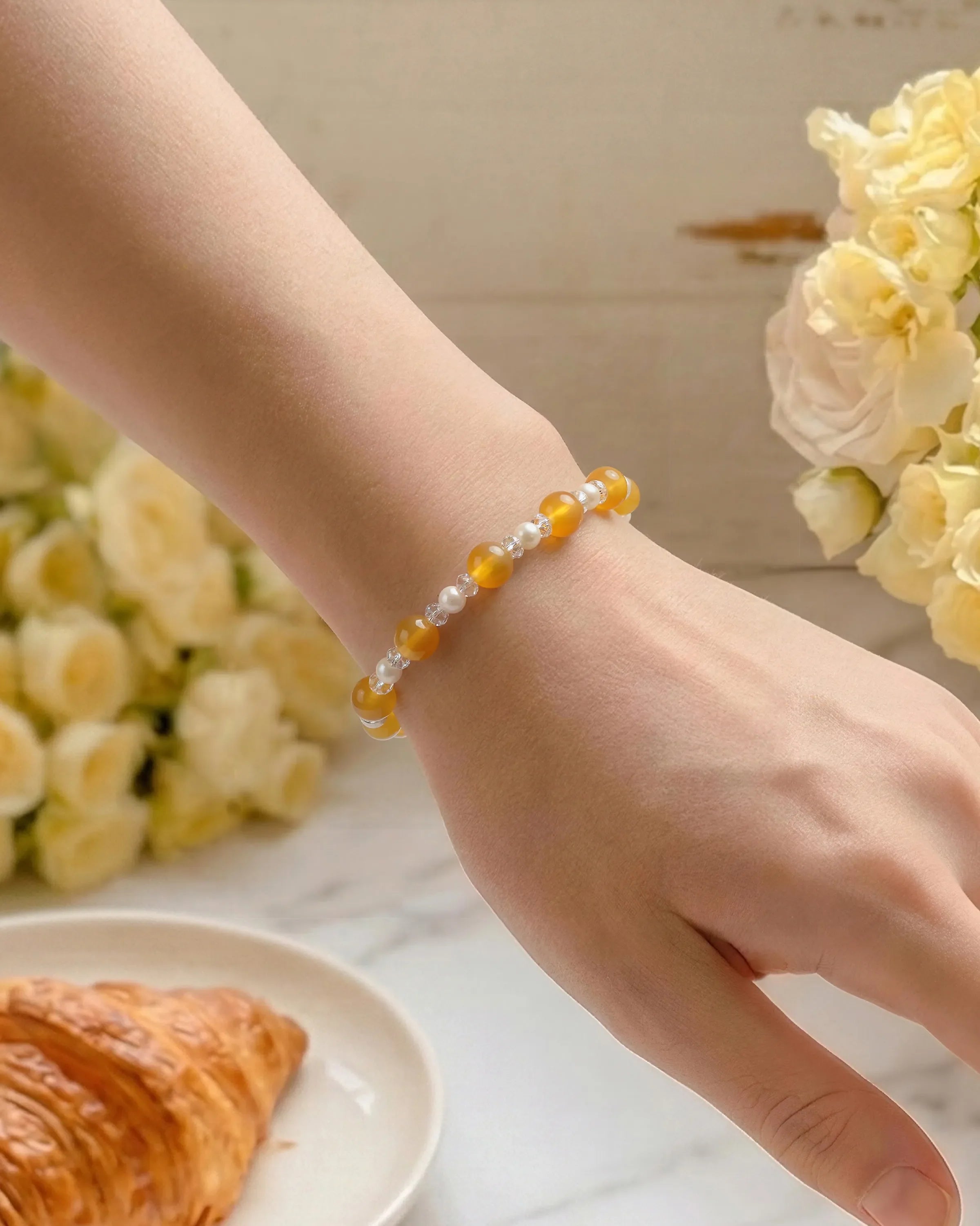 model wearing Yellow Jade and Pearl Silver Bracelet