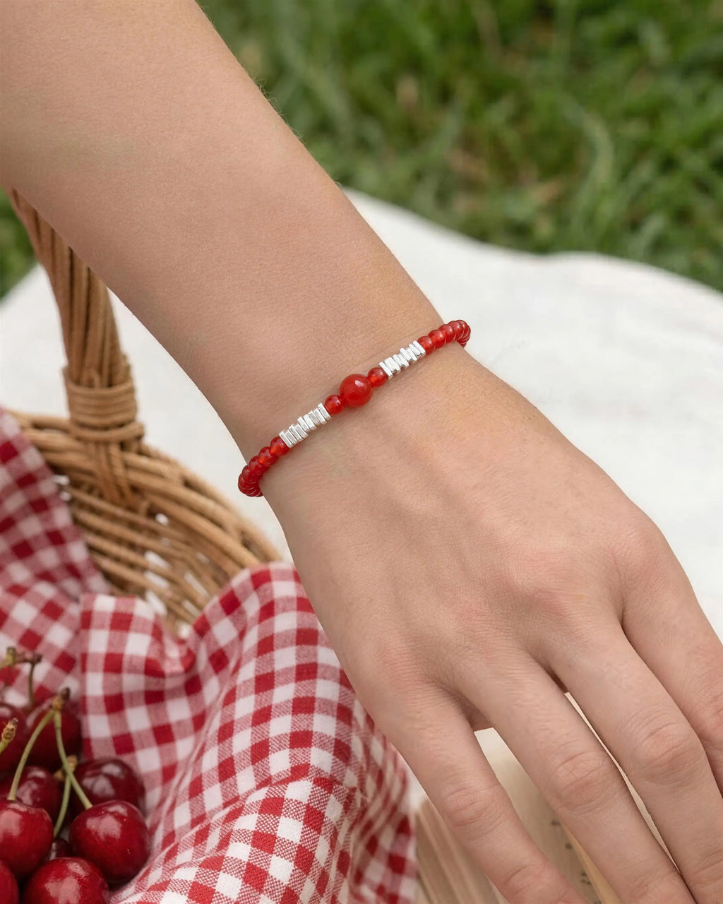 red agate beaded bracelet worn by model