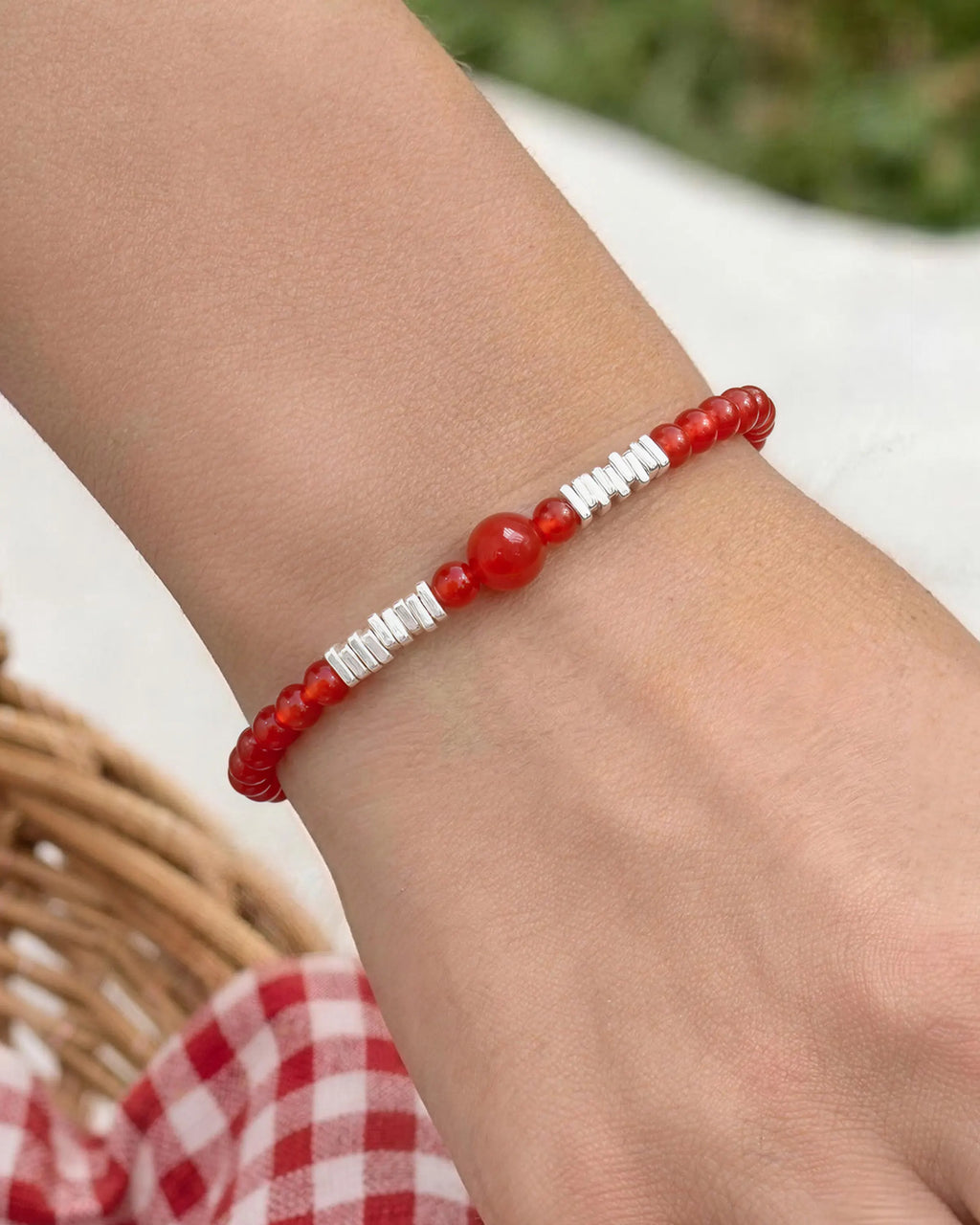 model wearing red agate beaded bracelet